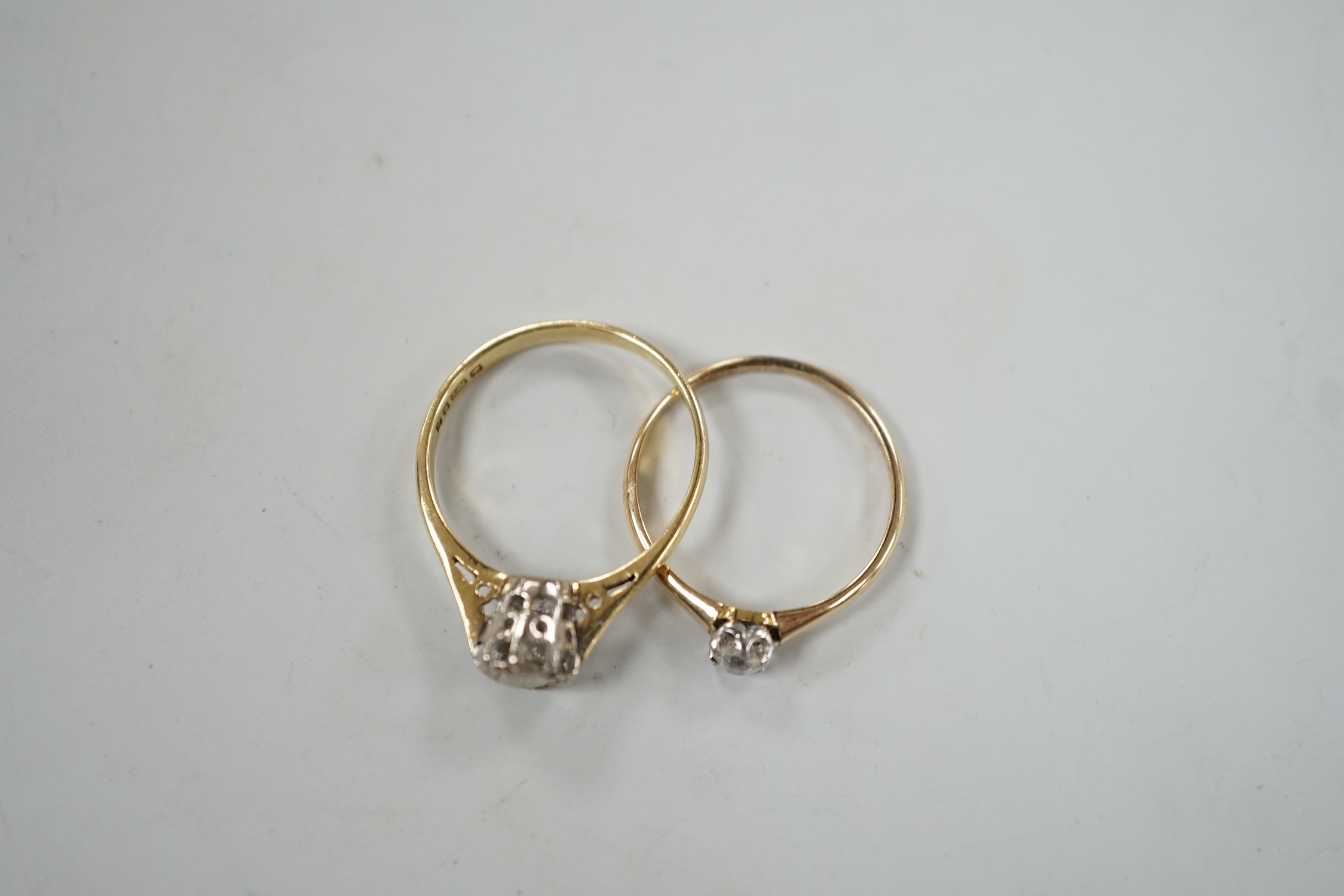 A modern 18ct gold and illusion set solitaire diamond ring, size N and one other smaller 18ct and solitaire diamond ring, gross weight 3.7 grams.